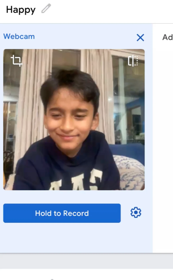 Happy class open with webcam preview of a smiling child and the Hold to Record button